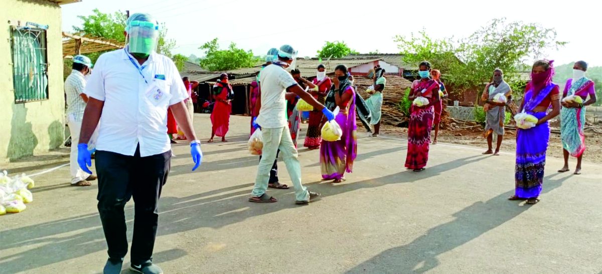Volunteers distributing ration kits during COVID-19